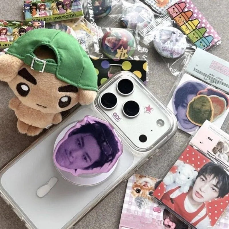 CORTIS Keonho Puppy plush bag charm shown with phone accessories